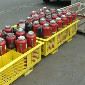 Floor-standing fire extinguisher storage rack, powder-coated safety yellow, fully loaded