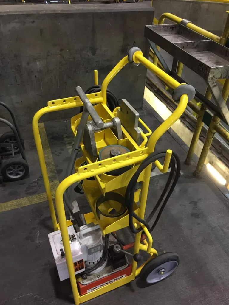 GE FDL engine tool dolly loaded with cam segment and journal bushing tools